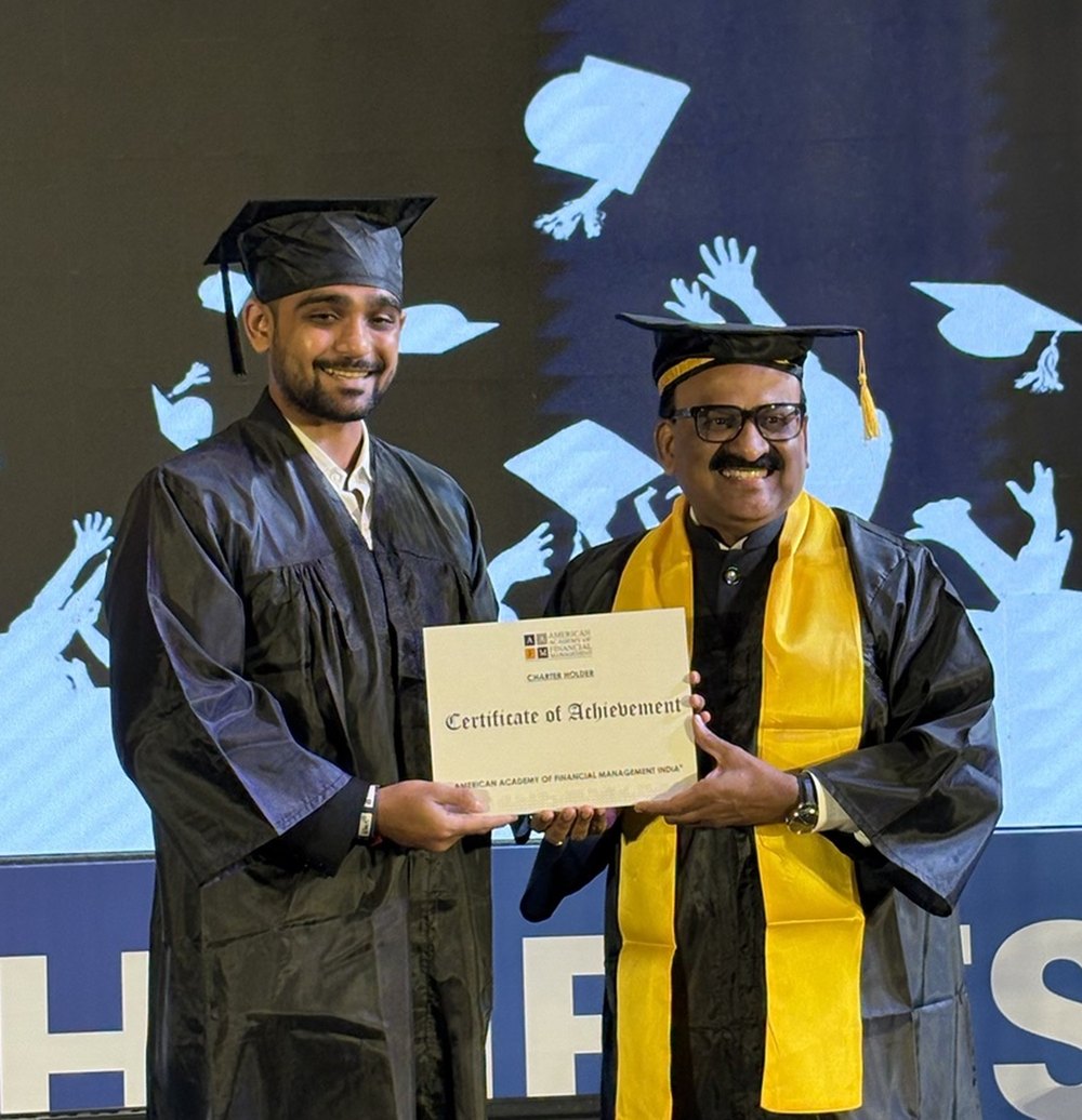 Kashyap Bhalodiya receiving the CWM charter on stage